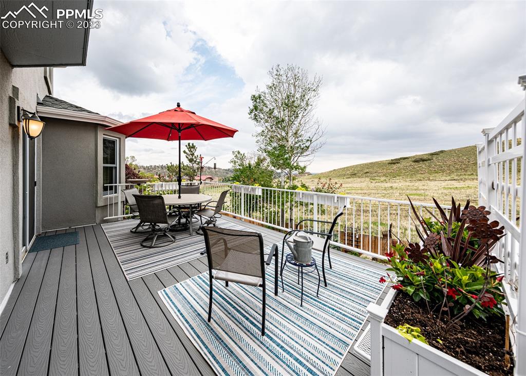 2145 Wickes Road Colorado Springs, CO 80919 - Photo 40 of 50 an outdoor space with seating