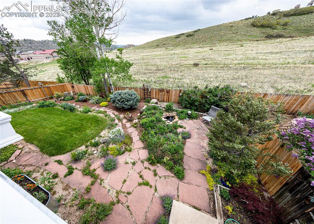 2145 Wickes Road Colorado Springs, CO 80919 - Photo 42 of 50 a view of a garden with an ocean view