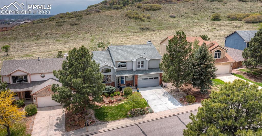 2145 Wickes Road Colorado Springs, CO 80919 - Photo 46 of 50 an aerial view of a house with a yard