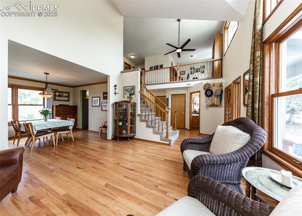 2145 Wickes Road Colorado Springs, CO 80919 - Photo 7 of 50 a living room with furniture and wooden floor