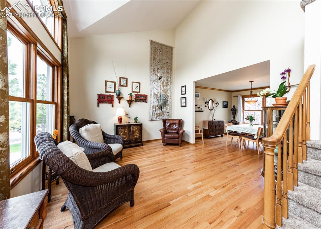 2145 Wickes Road Colorado Springs, CO 80919 - Photo 8 of 50 a living room with furniture and a wooden floor