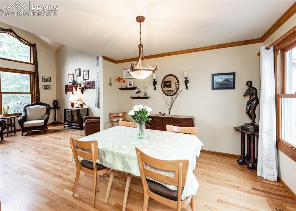 2145 Wickes Road Colorado Springs, CO 80919 - Photo 10 of 50 a living room with furniture a flat screen tv and a window