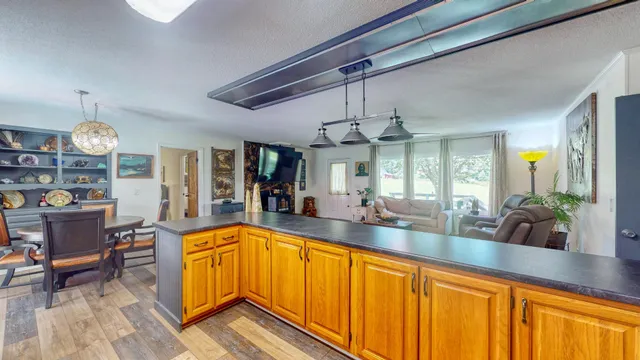 a view of a living room and dining area