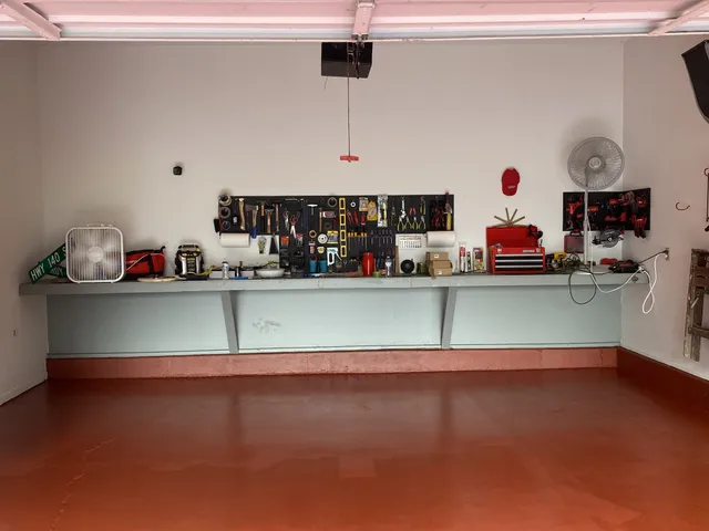 a kitchen with kitchen island a sink and a wooden floors