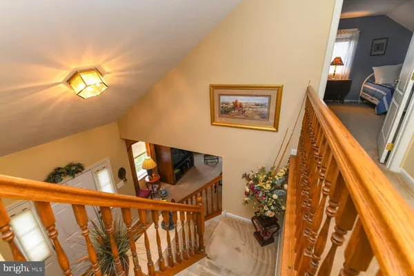 a view of staircase with wooden floor