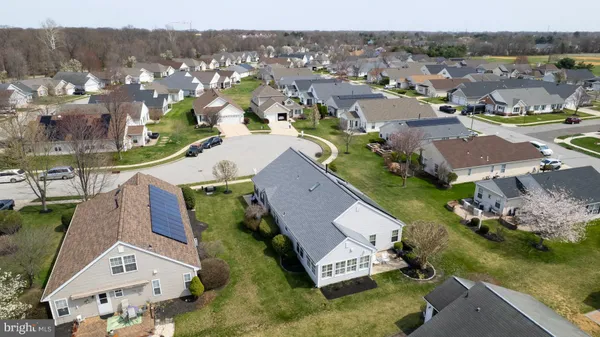 an aerial view of a house with a garden