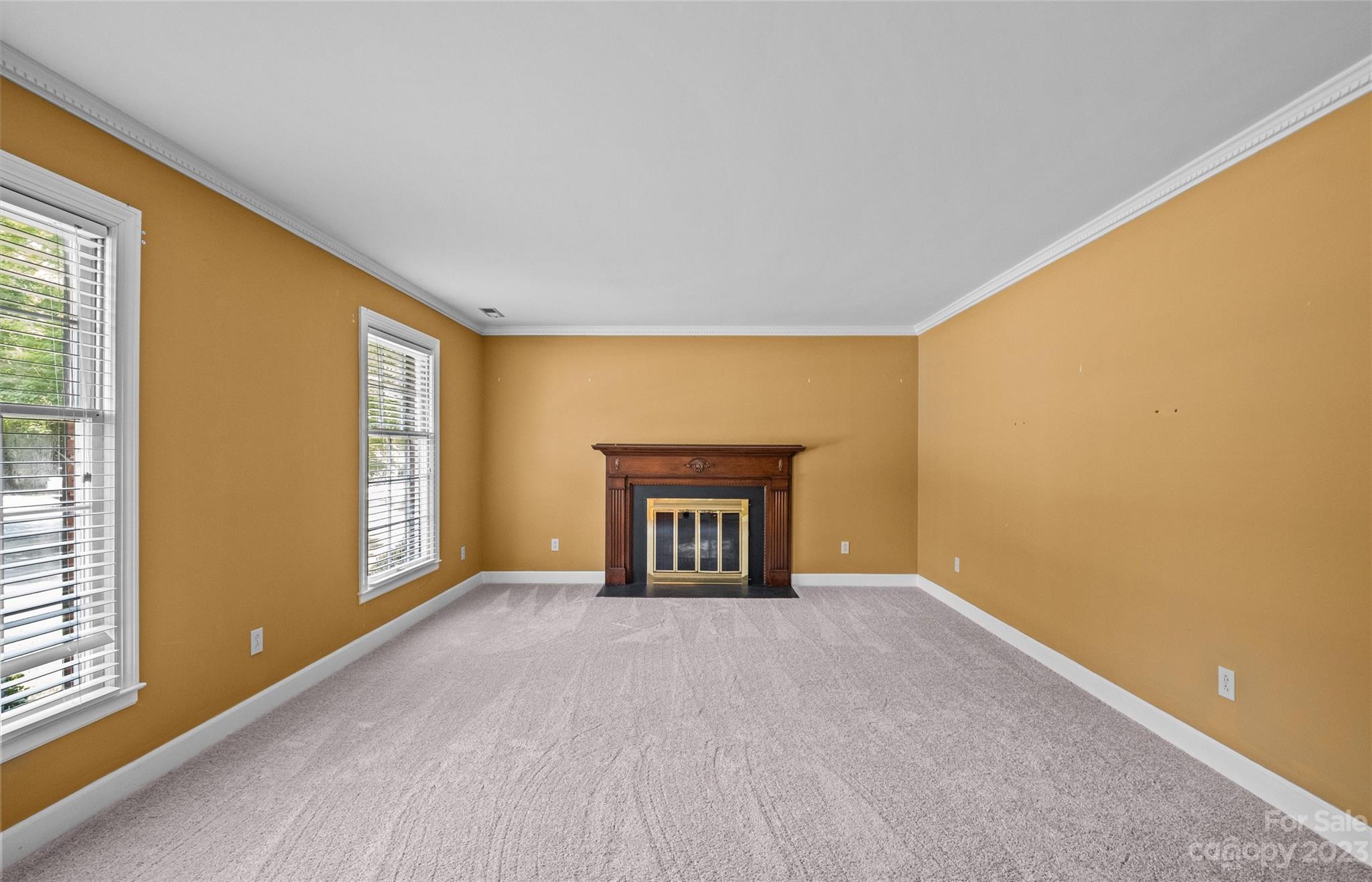 3424 Colony Road Charlotte, NC 28211 - Photo 7 of 48 a view of an empty room with a window and fireplace
