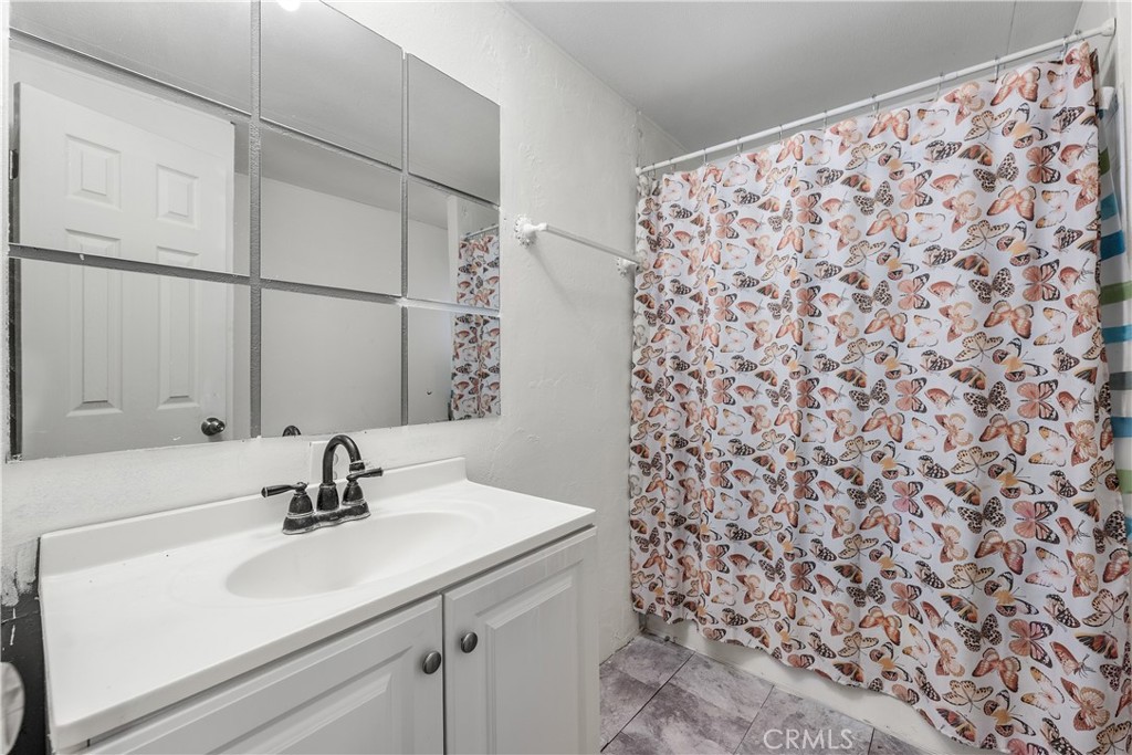 18540 Soledad Canyon Road, Unit 124 Canyon Country, CA 91351 - Photo 11 of 20 a bathroom with a sink and a mirror