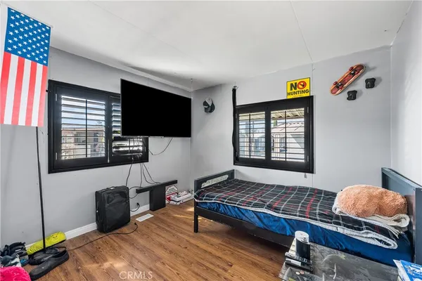 a living room with furniture rug and a window
