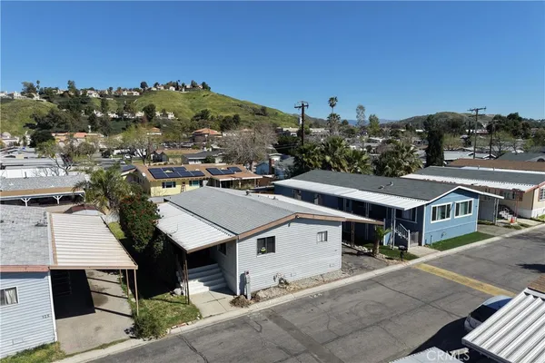 an aerial view of residential houses with outdoor space