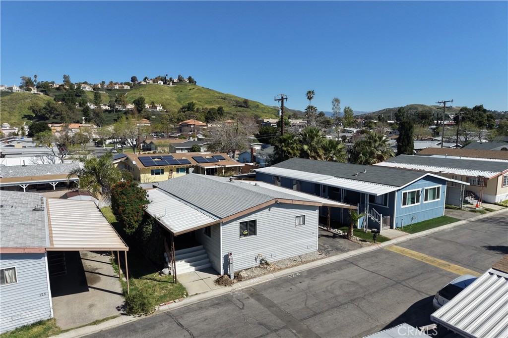 18540 Soledad Canyon Road, Unit 124 Canyon Country, CA 91351 - Photo 19 of 20 an aerial view of residential houses with outdoor space