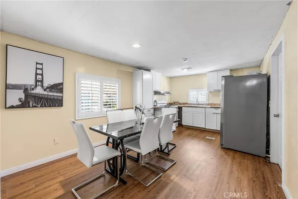 a dining room with furniture and window