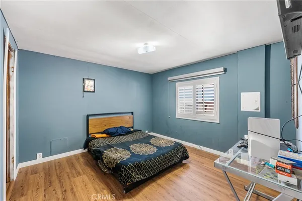 a bedroom with a bed and window