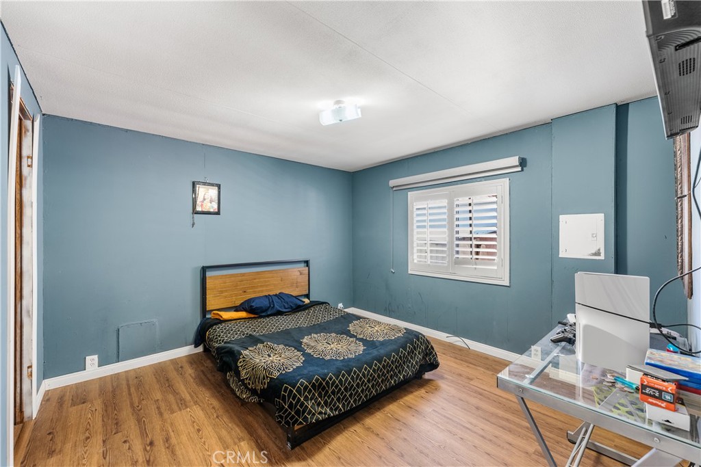 18540 Soledad Canyon Road, Unit 124 Canyon Country, CA 91351 - Photo 10 of 20 a bedroom with a bed and window
