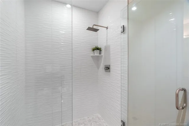 a bedroom with a large bed and a large window