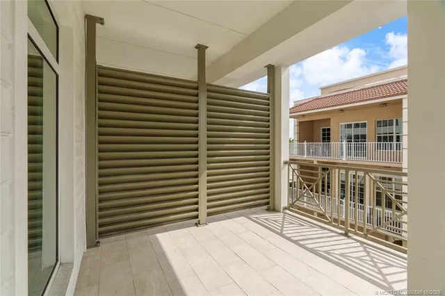a view of a balcony with furniture