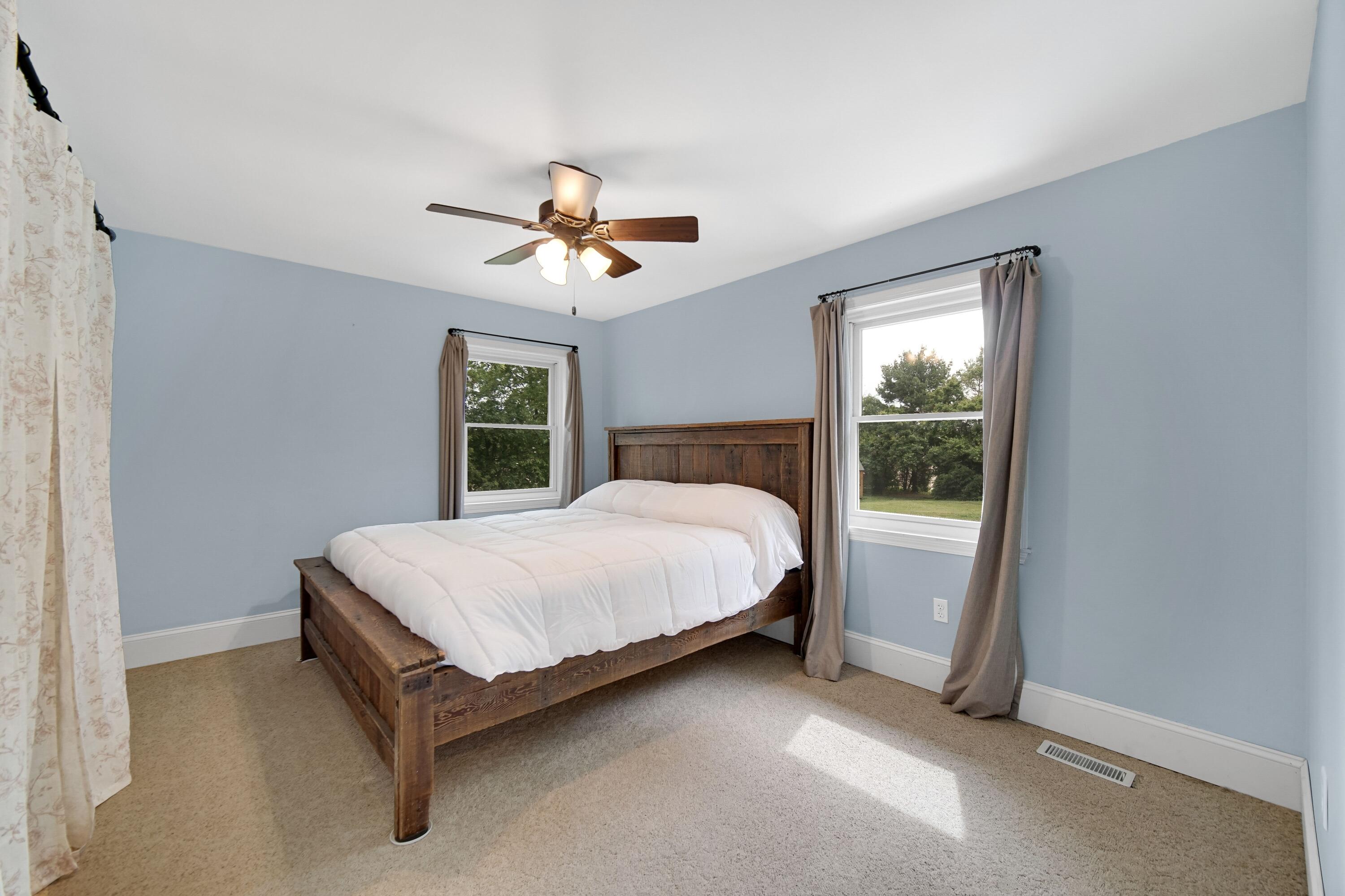 476 Highway 2 Hebron, IN 46341 - Photo 15 of 25 a bed sitting in a spacious bedroom next to a window