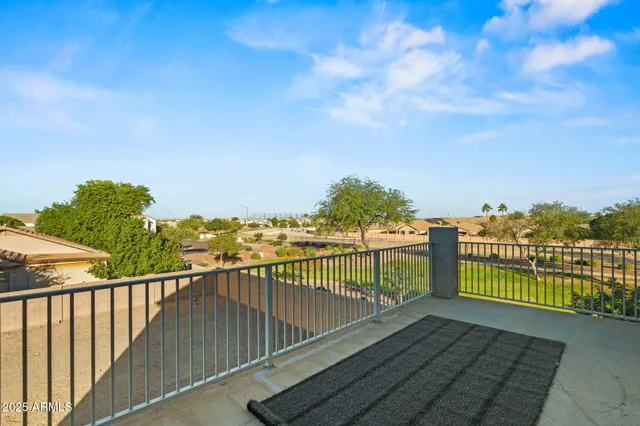 a view of a balcony with wooden floor