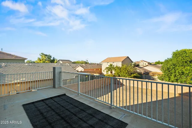 a view of balcony with wooden floor