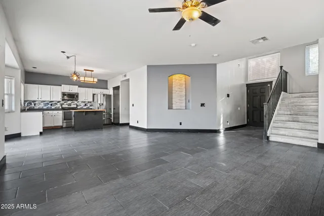 a view of a kitchen with a sink and a stove top oven