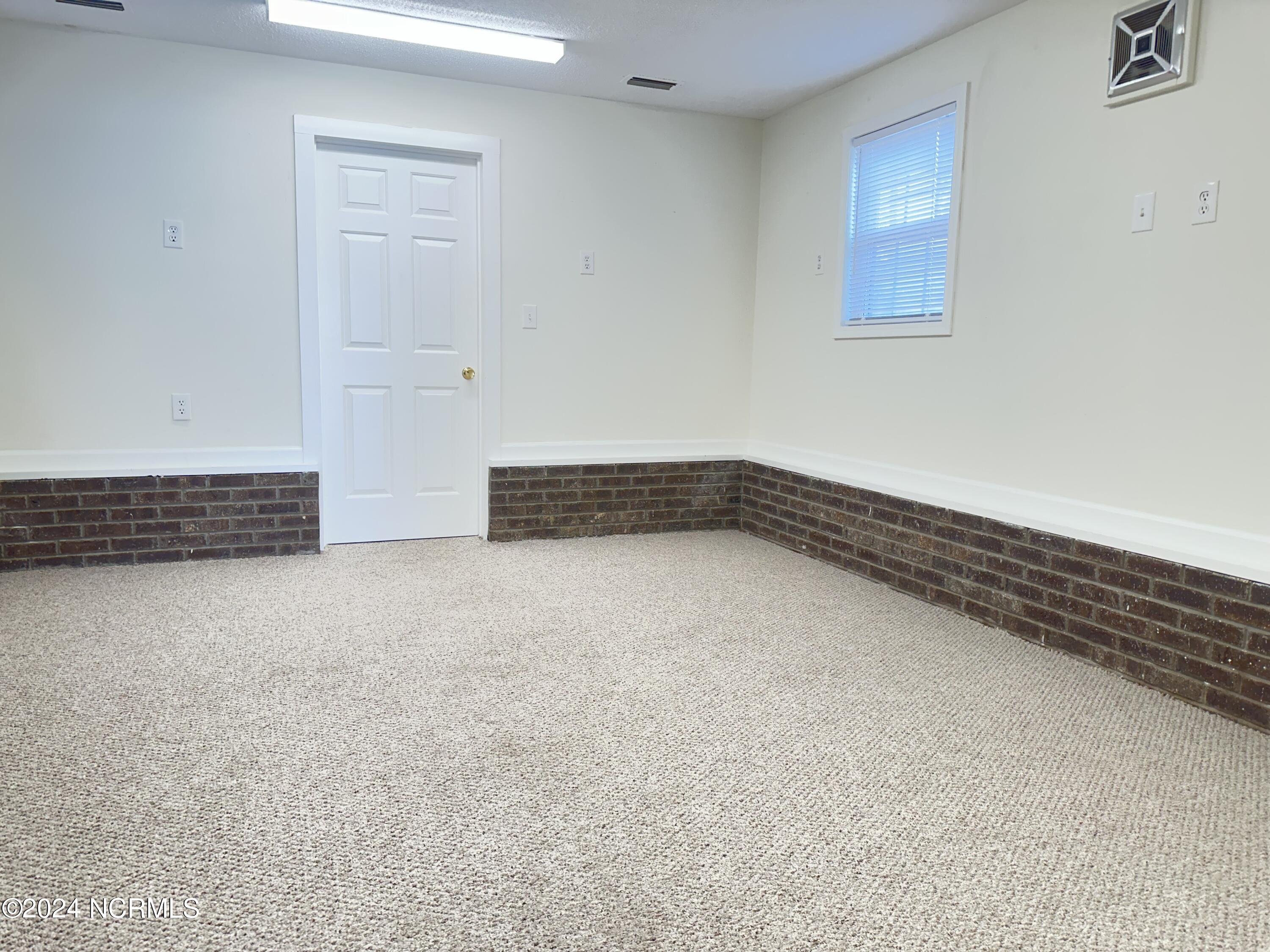409 Deer Path Calabash, NC 28467 - Photo 24 of 32 This room is heated and cooled, but has NOT been counted towards the total heated square footage of the home.