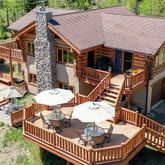 a aerial view of a house with table and chairs