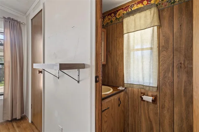 a bathroom with a shower and a sink