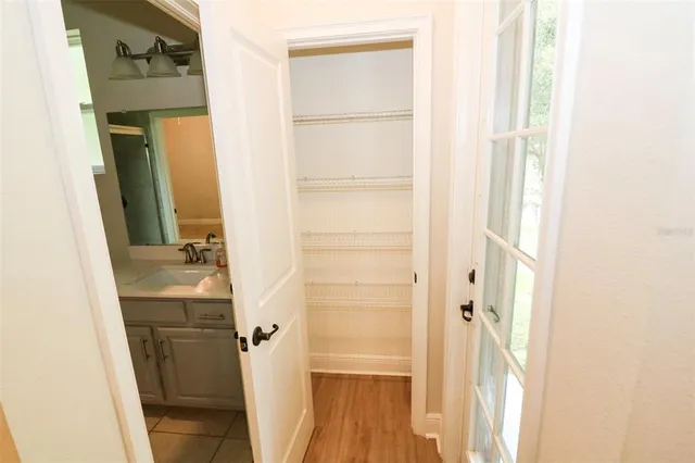 a bathroom with a sink a mirror and a shower