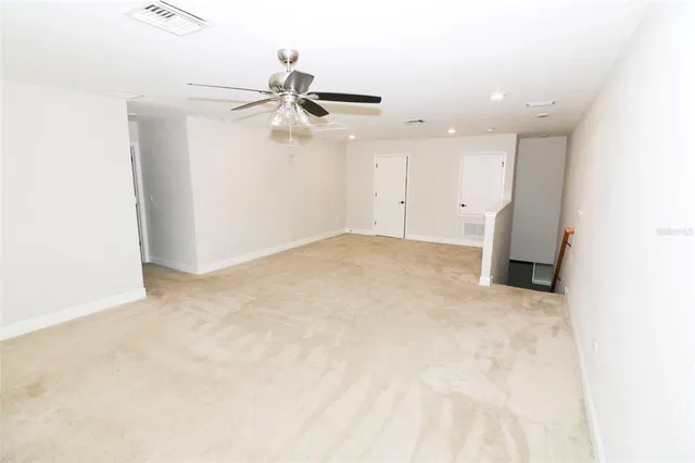 a view of a big room with carpet