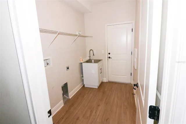 a view of a room with wooden floor and staircase