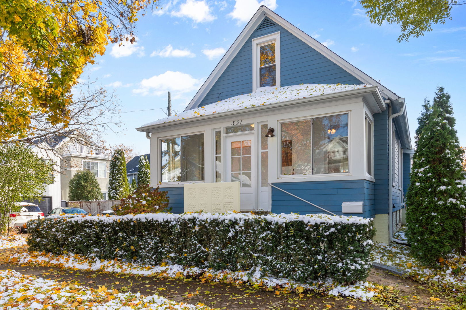a front view of a house with a garden