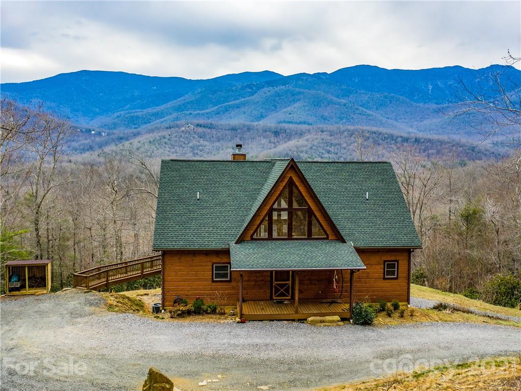 263 Mount Mitchell Drive Burnsville, NC 28714 - Photo 11 of 39 a front view of a house with a yard
