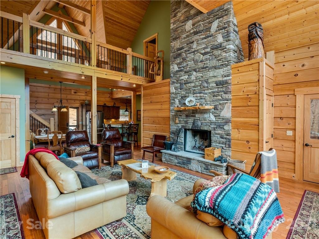 263 Mount Mitchell Drive Burnsville, NC 28714 - Photo 13 of 39 a view of a living room with furniture and a fireplace