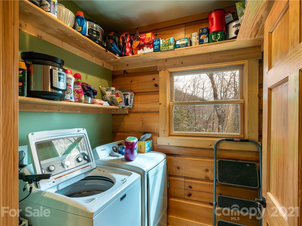 263 Mount Mitchell Drive Burnsville, NC 28714 - Photo 16 of 39 a utility room with sink dryer and washer