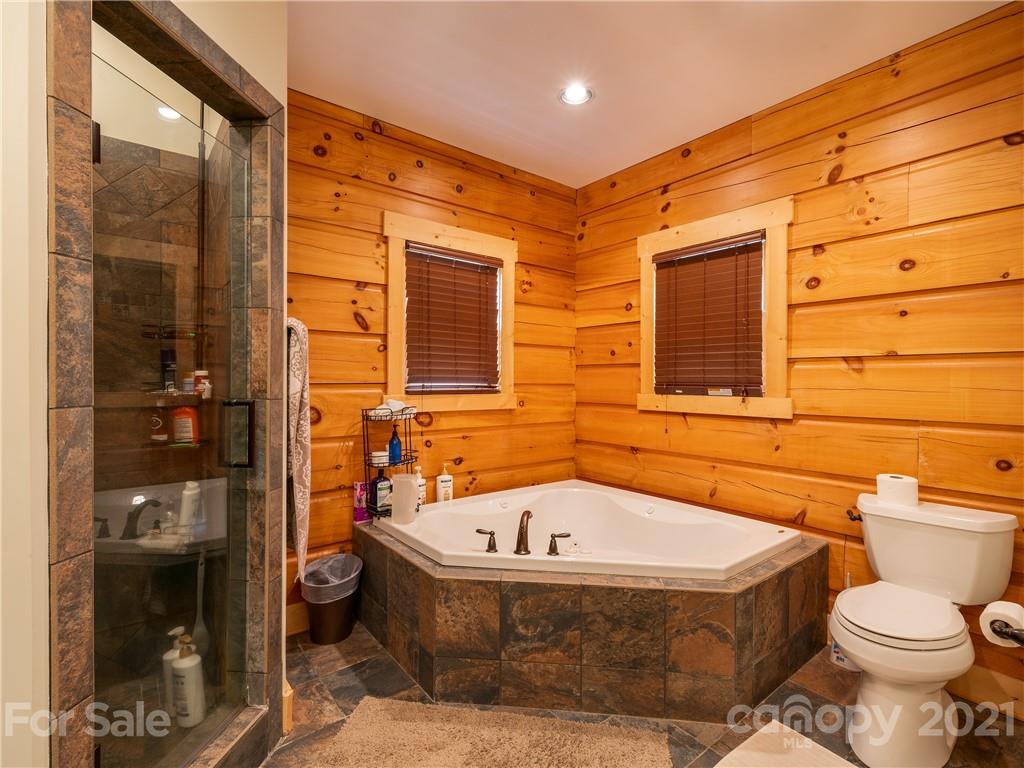 263 Mount Mitchell Drive Burnsville, NC 28714 - Photo 18 of 39 a bathroom with a sink and toilet
