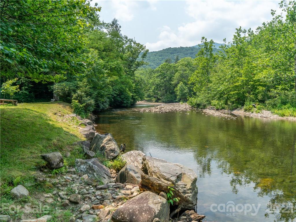263 Mount Mitchell Drive Burnsville, NC 28714 - Photo 3 of 39 a view of a lake with a city
