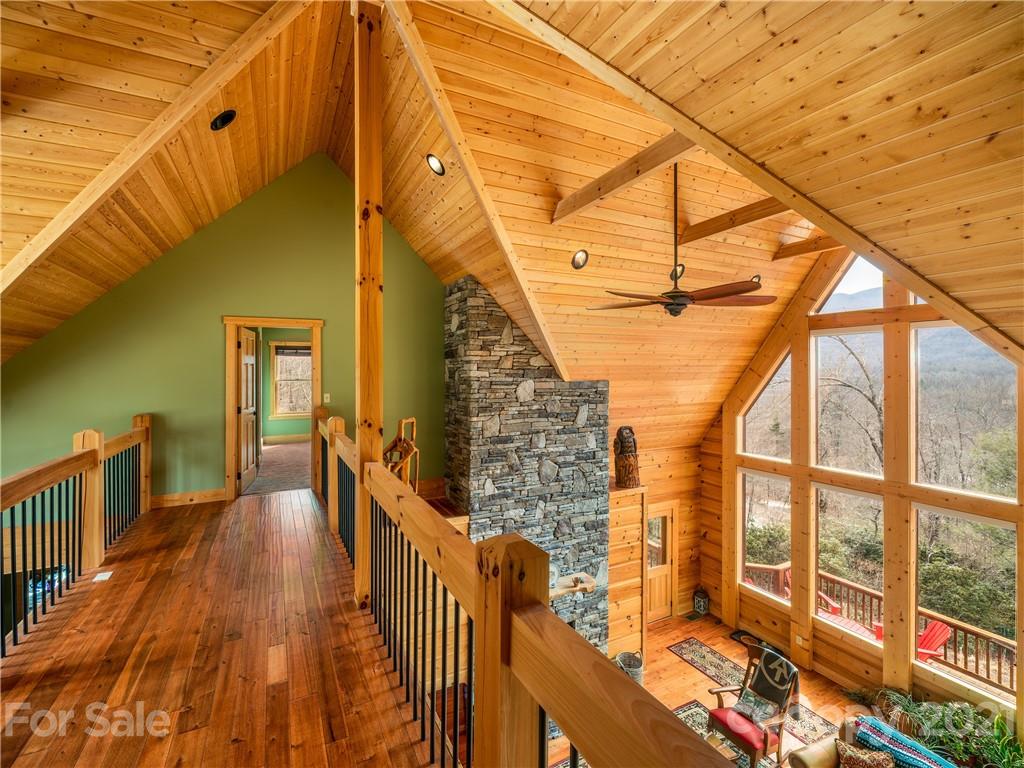 263 Mount Mitchell Drive Burnsville, NC 28714 - Photo 22 of 39 a view of a balcony with wooden floor and furniture