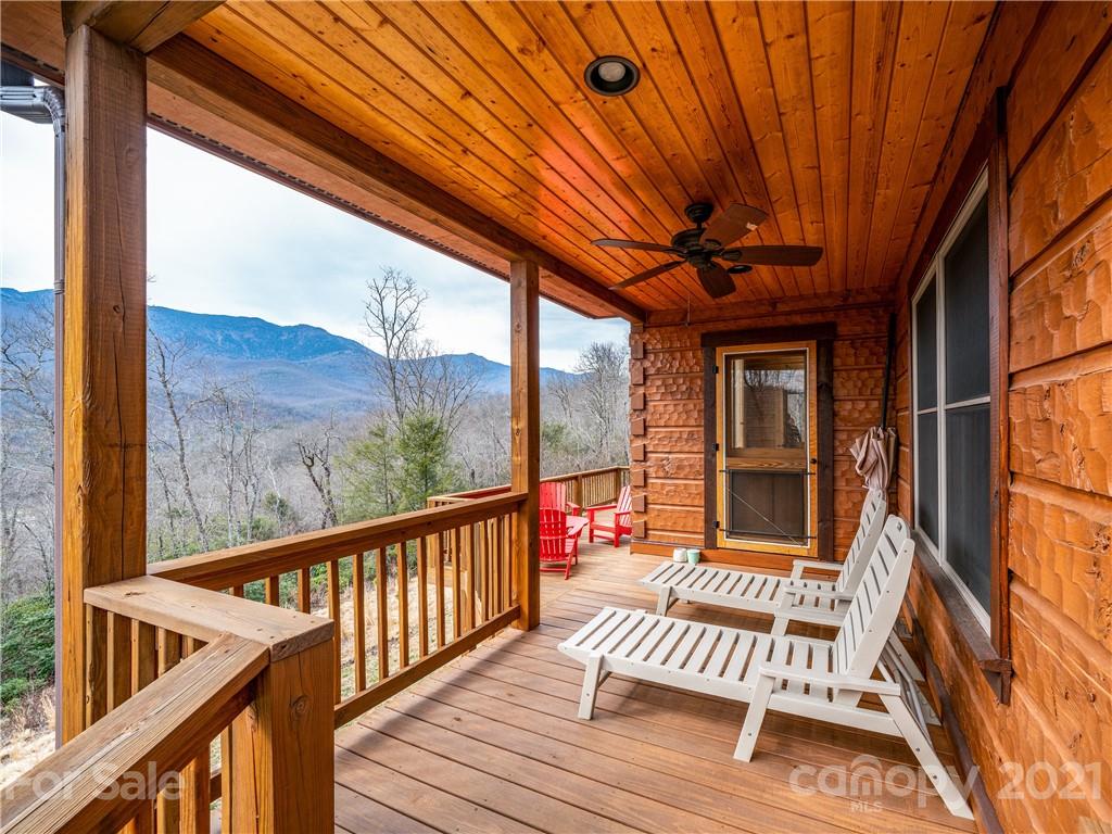 263 Mount Mitchell Drive Burnsville, NC 28714 - Photo 29 of 39 a view of balcony with wooden floor and outdoor seating