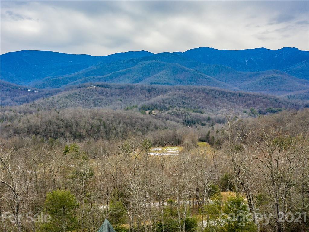 263 Mount Mitchell Drive Burnsville, NC 28714 - Photo 31 of 39 a view of a house with a mountain