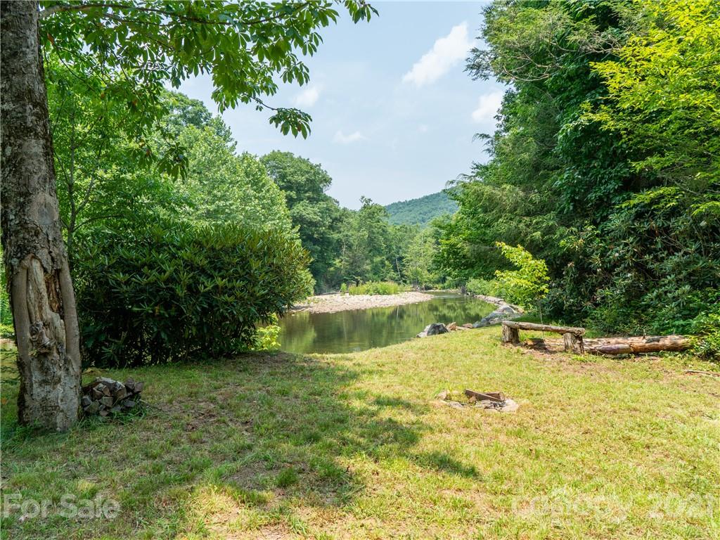 263 Mount Mitchell Drive Burnsville, NC 28714 - Photo 36 of 39 a view of a swimming pool with a yard