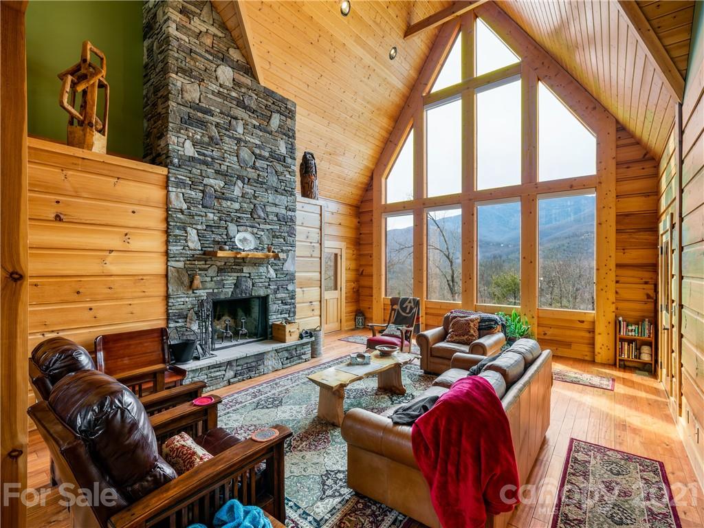 263 Mount Mitchell Drive Burnsville, NC 28714 - Photo 7 of 39 a living room with furniture and a fireplace