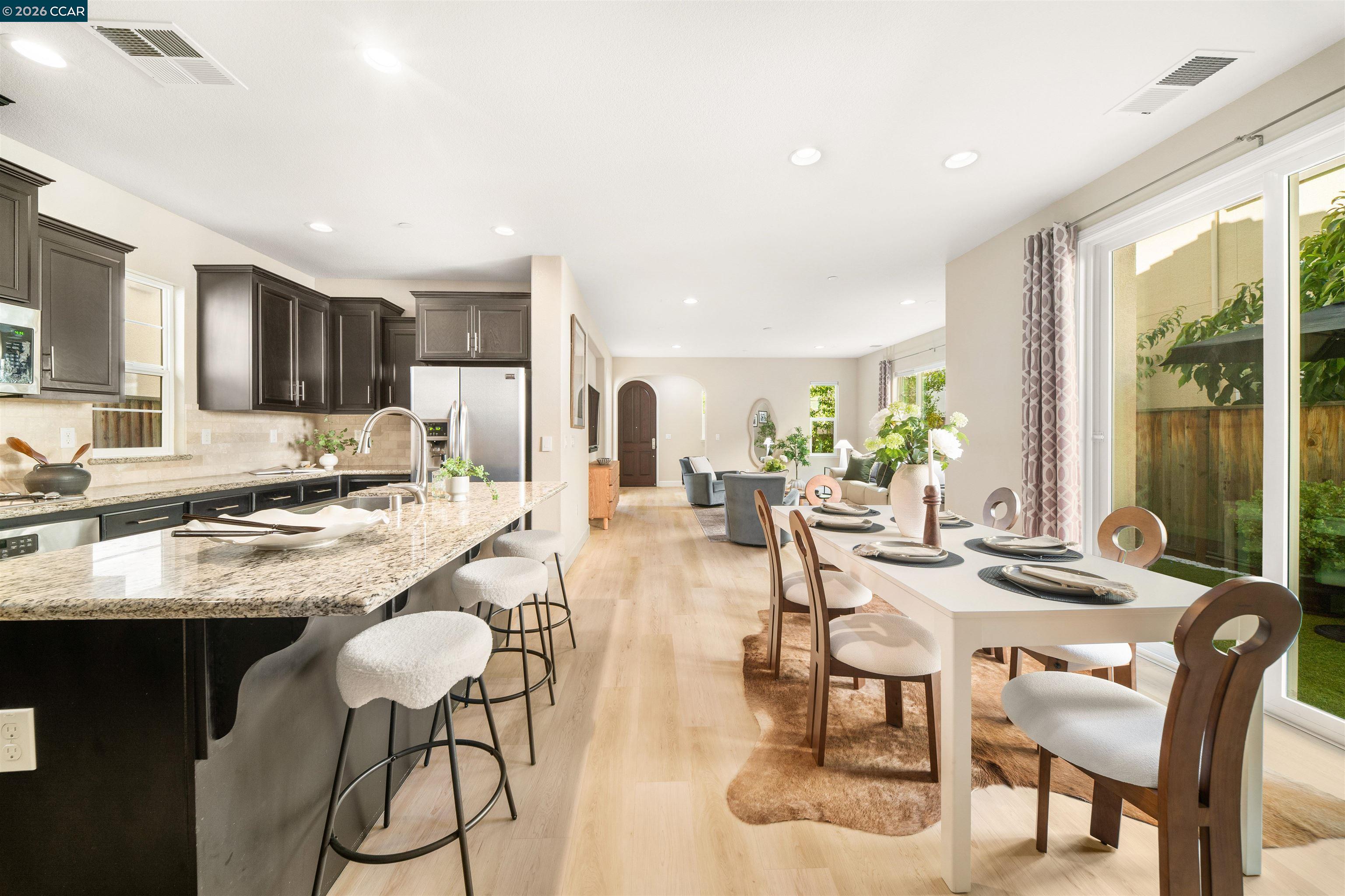 2026 Poinsettia Street San Ramon, CA 94582 - Photo 7 of 26 a view of a dining room kitchen counter top space and living room