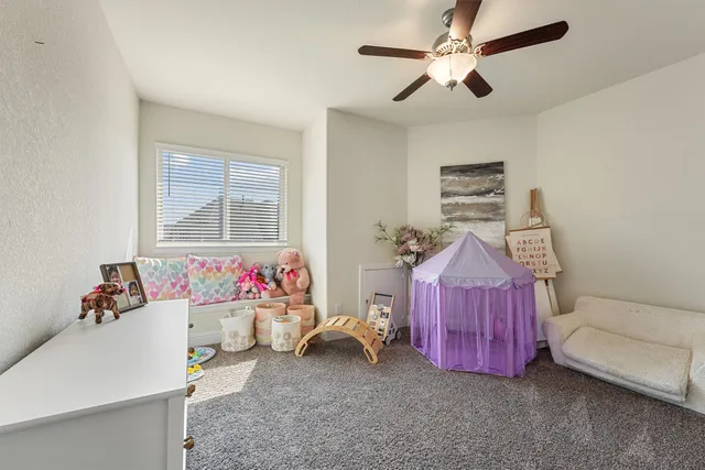 a bedroom with furniture and a chandelier