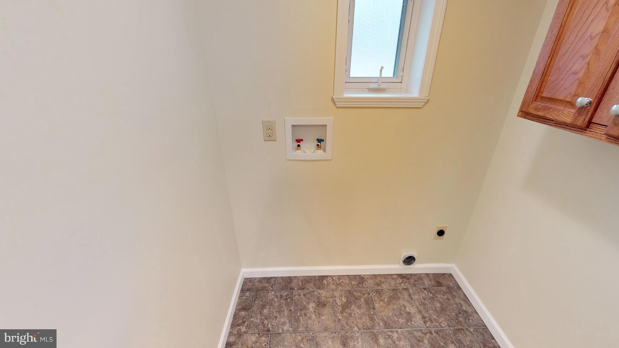 13904 Craddock Road Southwest Cumberland, MD 21502 - Photo 16 of 25 Laundry has tile flooring and lots of storage