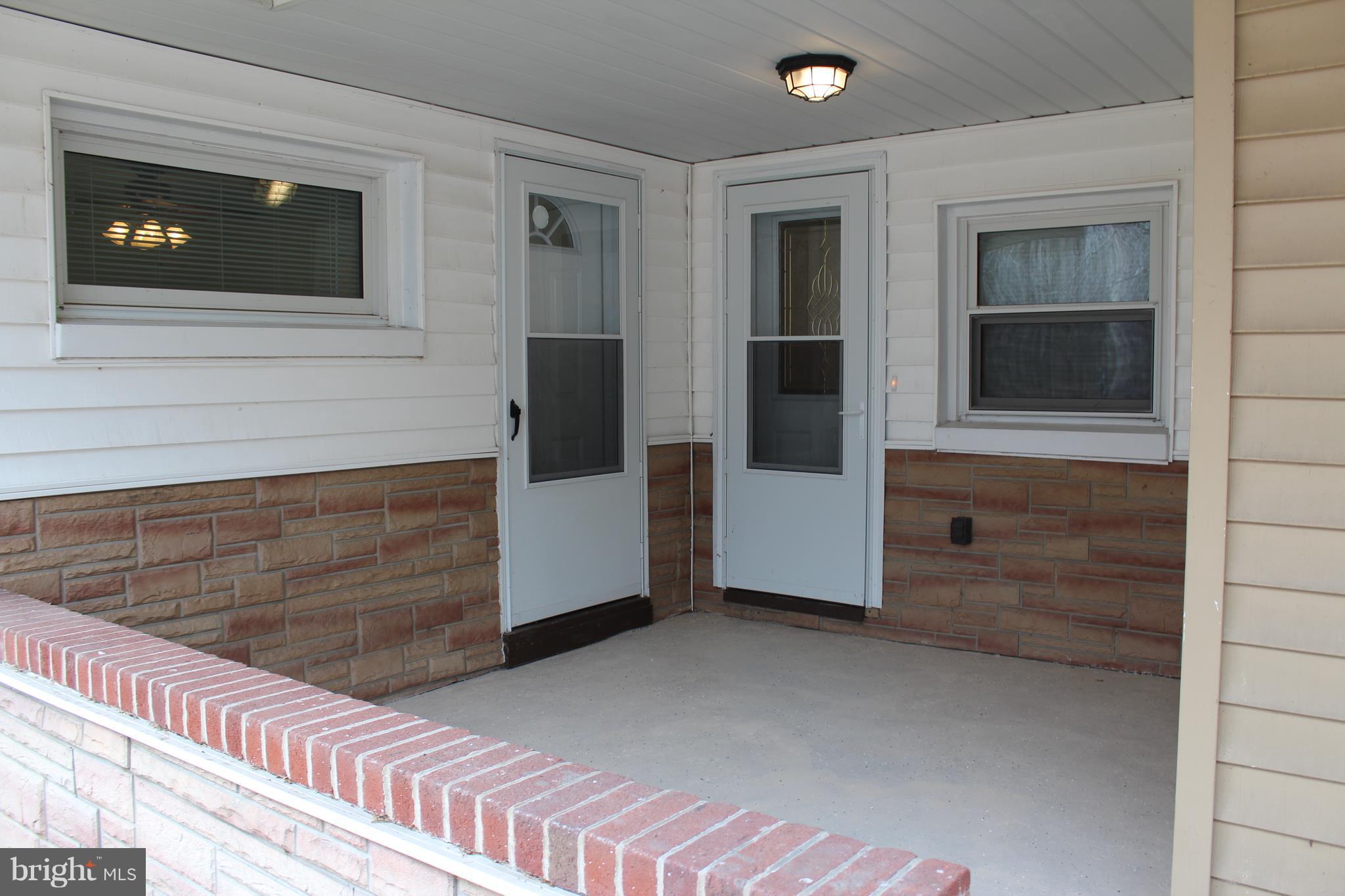 13904 Craddock Road Southwest Cumberland, MD 21502 - Photo 17 of 25 Enjoy the outdoors on the covered front porch