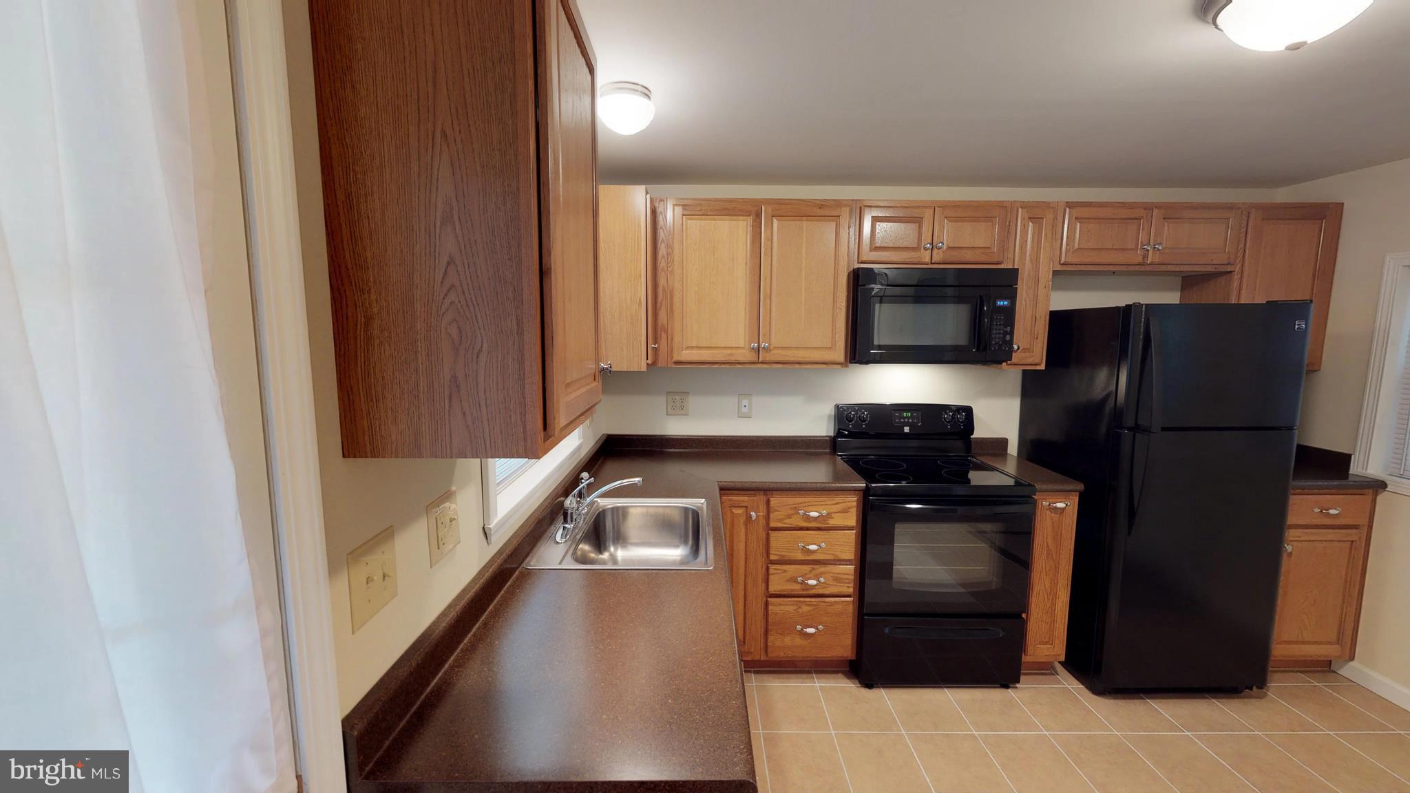 13904 Craddock Road Southwest Cumberland, MD 21502 - Photo 2 of 25 Featuring an oak kitchen with all appliances