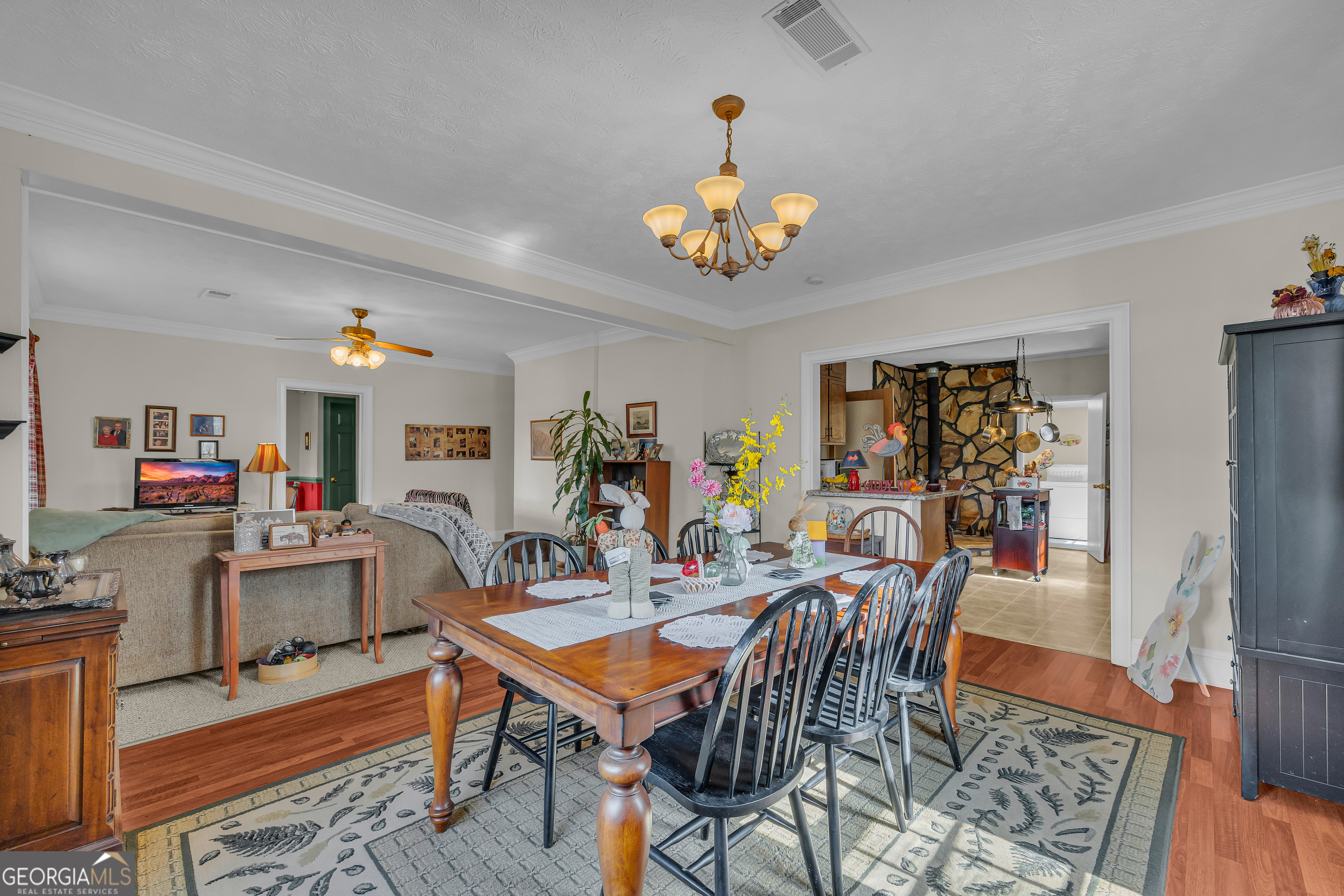 1640 Wire Bridge Road Watkinsville, GA 30677 - Photo 11 of 74 a view of a dining room with furniture and wooden floor