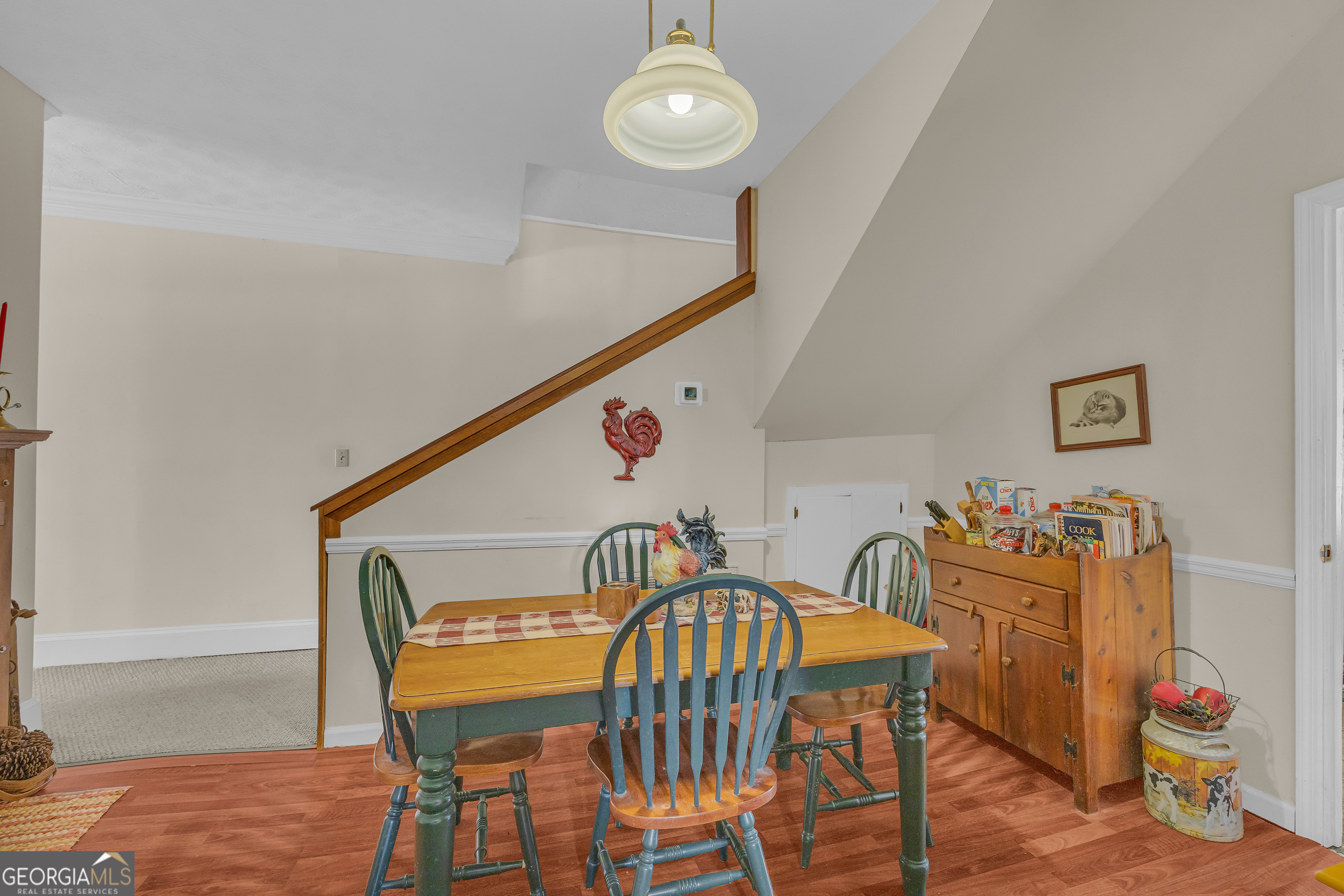 1640 Wire Bridge Road Watkinsville, GA 30677 - Photo 16 of 74 a view of a dining room with furniture and wooden floor