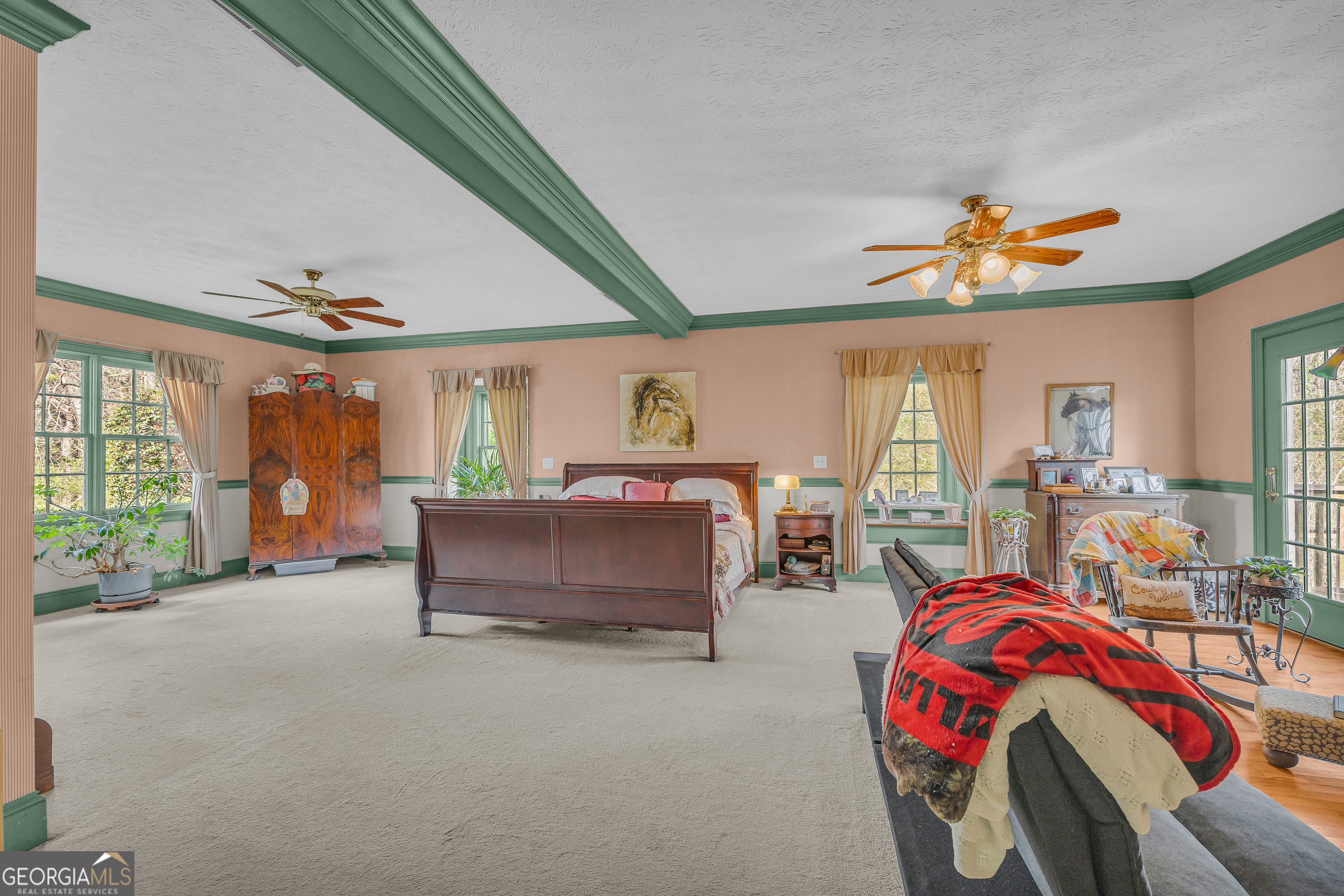 1640 Wire Bridge Road Watkinsville, GA 30677 - Photo 20 of 74 a spacious bedroom with a bed and a chandelier