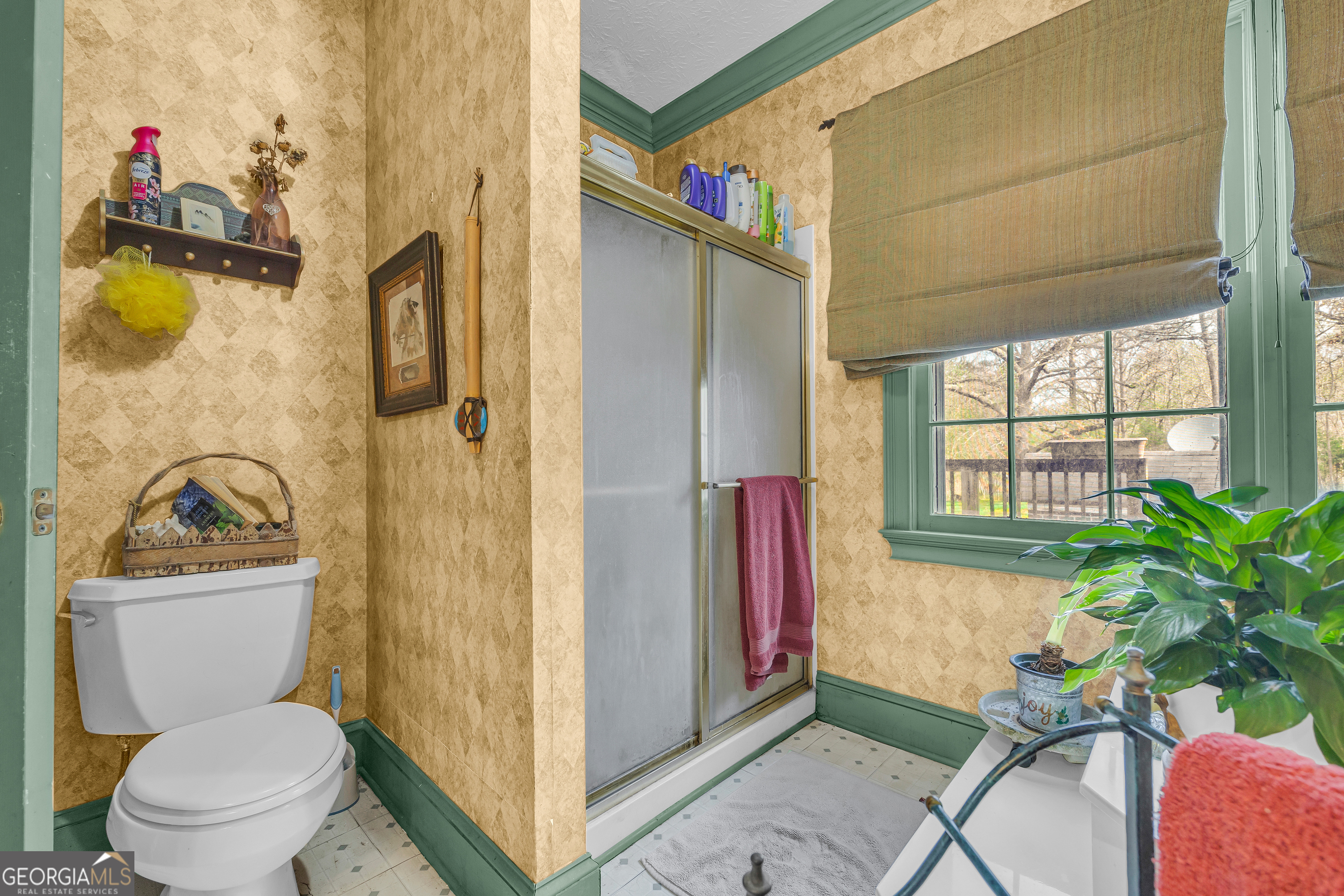 1640 Wire Bridge Road Watkinsville, GA 30677 - Photo 23 of 74 a bathroom with a granite countertop sink a toilet and shower